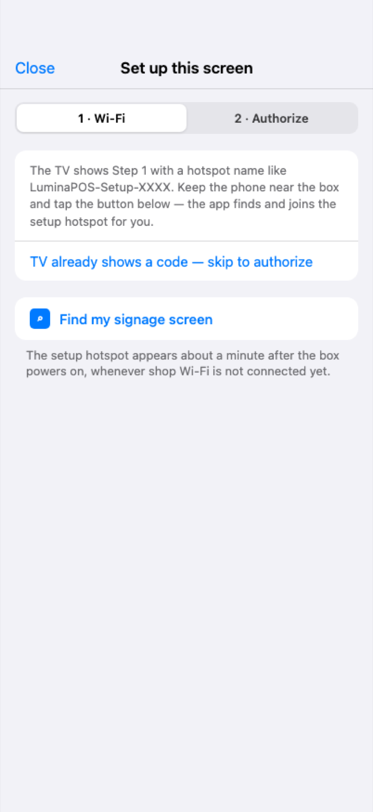 iPhone LuminaPOS app on the signage Wi‑Fi setup step